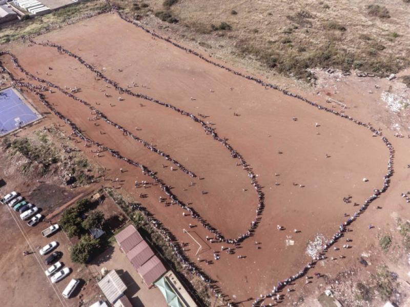 Aerial view of the queue of residents of an informal settlement waiting to receive their food parcels on 20 May.