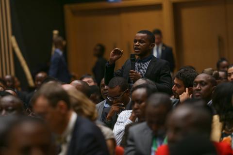 Youth in Rwanda engage in a Q & A session