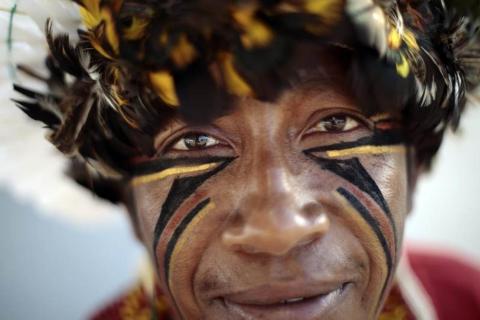 A Pataxo Indian living in Bahia, in northeastern Brazil, is seen near the Esplanade of Ministries in Brasilia March 12, 2014. The Indians are in Brasilia for meetings with authorities to discuss health needs and conflict issues between Indians and farmers