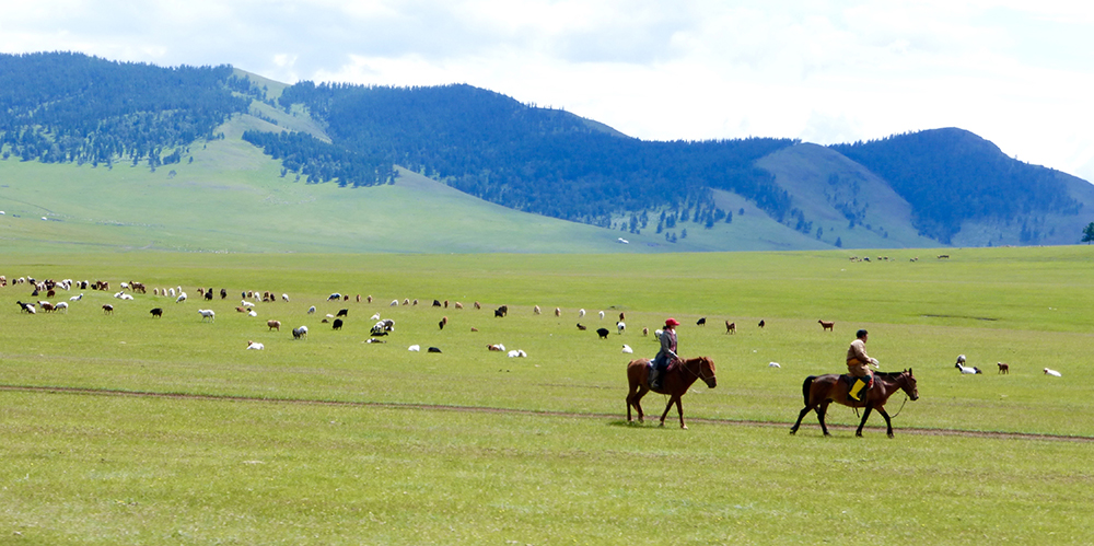 Two Herders, Yellow Boots, Red Hat, Mongolia, CC BY-NC-ND 2.0 license